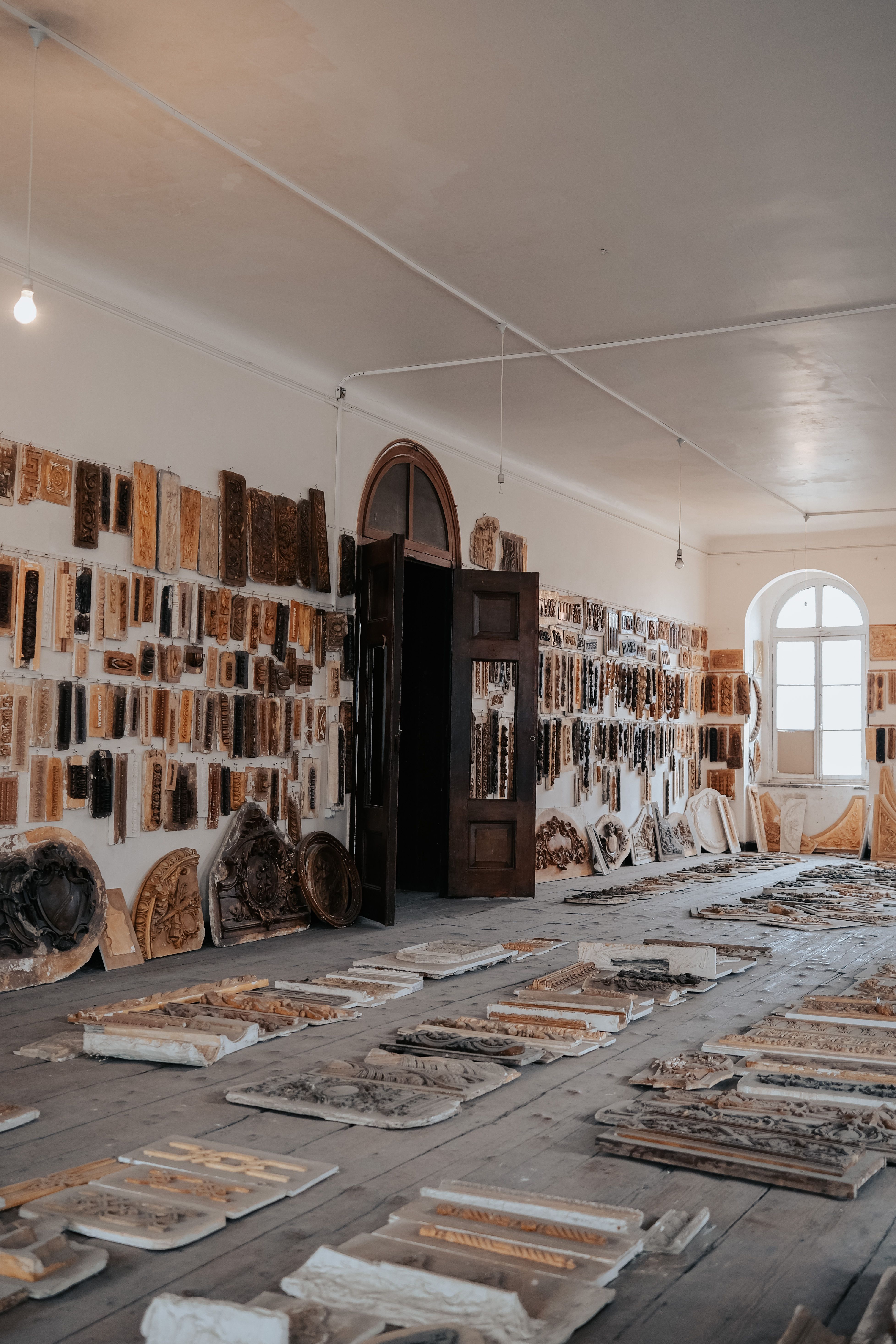 Workshop preparing custom flooring and trim materials for installation by Beyond Briks