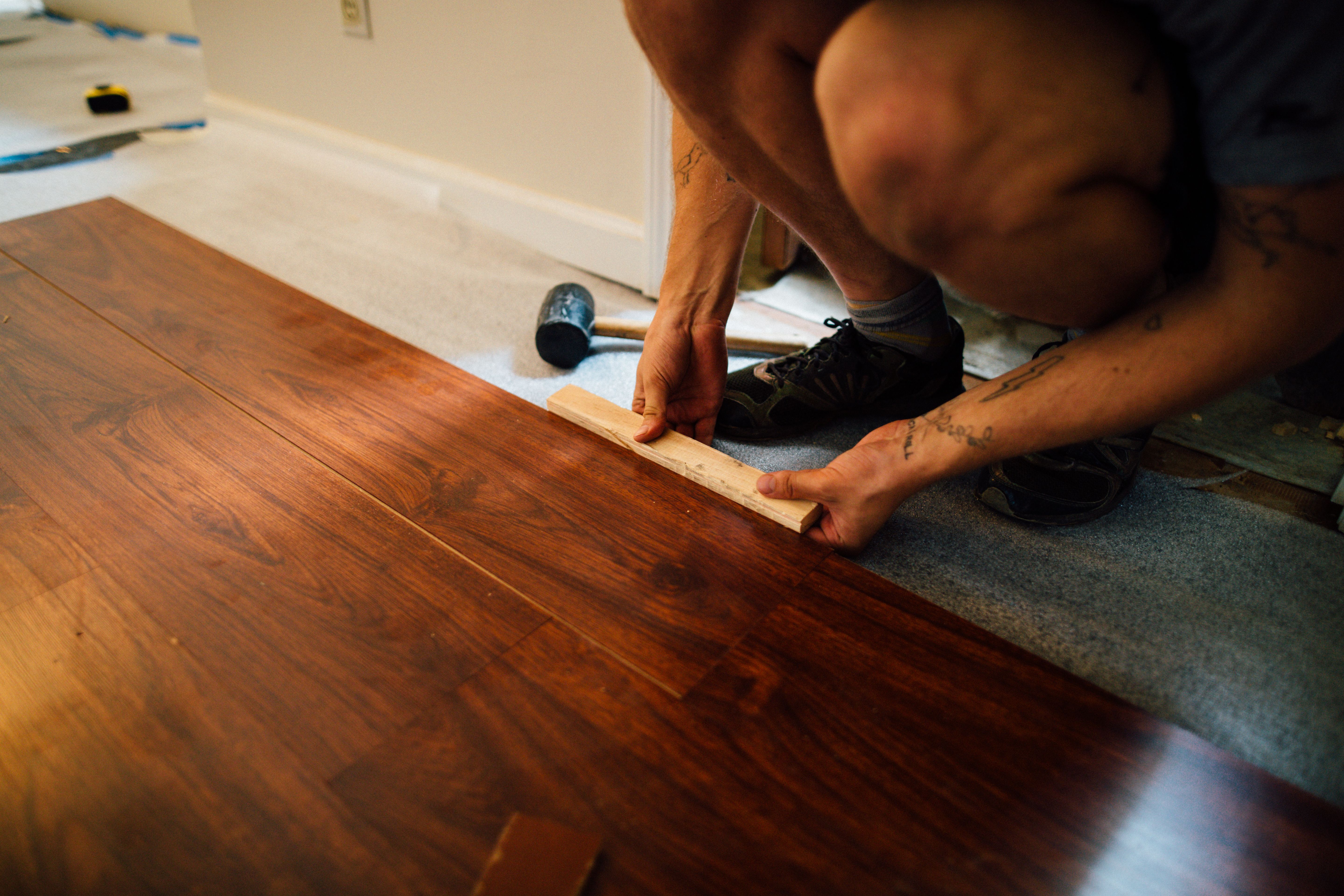 Modern wooden living room flooring installation transformation by Beyond Briks