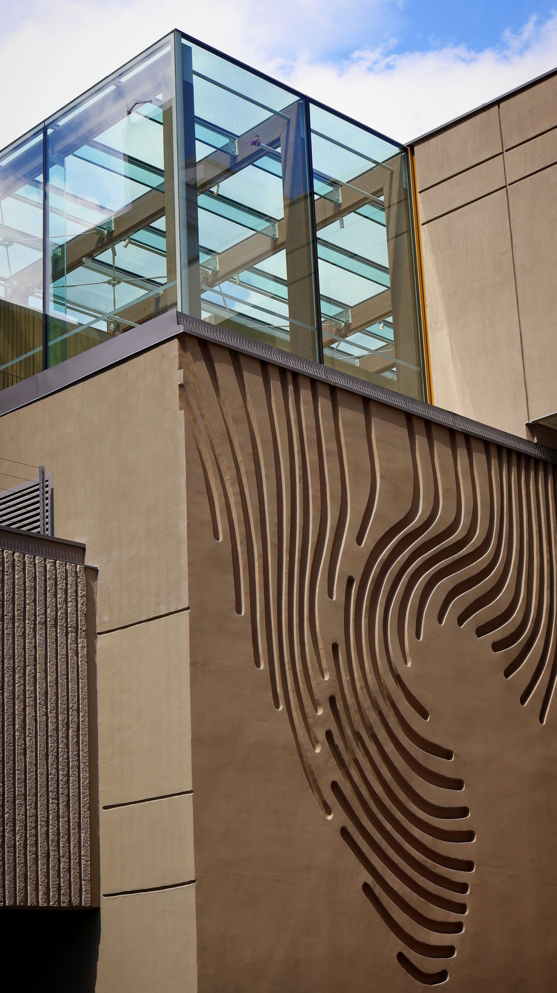 Contemporary architecture design solution — sculptural facade with fluted concrete detailing