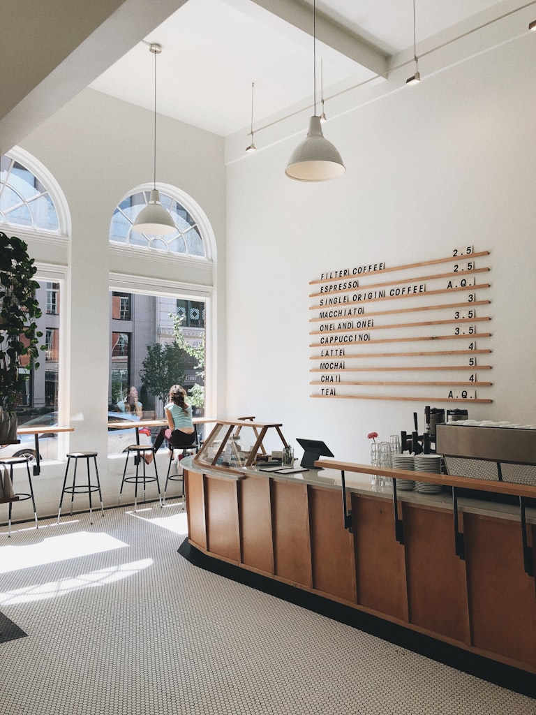 Minimalist restaurant interior design style with clean lines and natural light